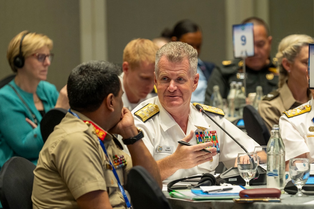 Adm. Samuel J. Paparo, commander of U.S. Indo-Pacific Command, engages a fellow chief of defence in discussion at a Chiefs of Defense Conference in Hua Hin, Thailand, Aug. 27, 2025.