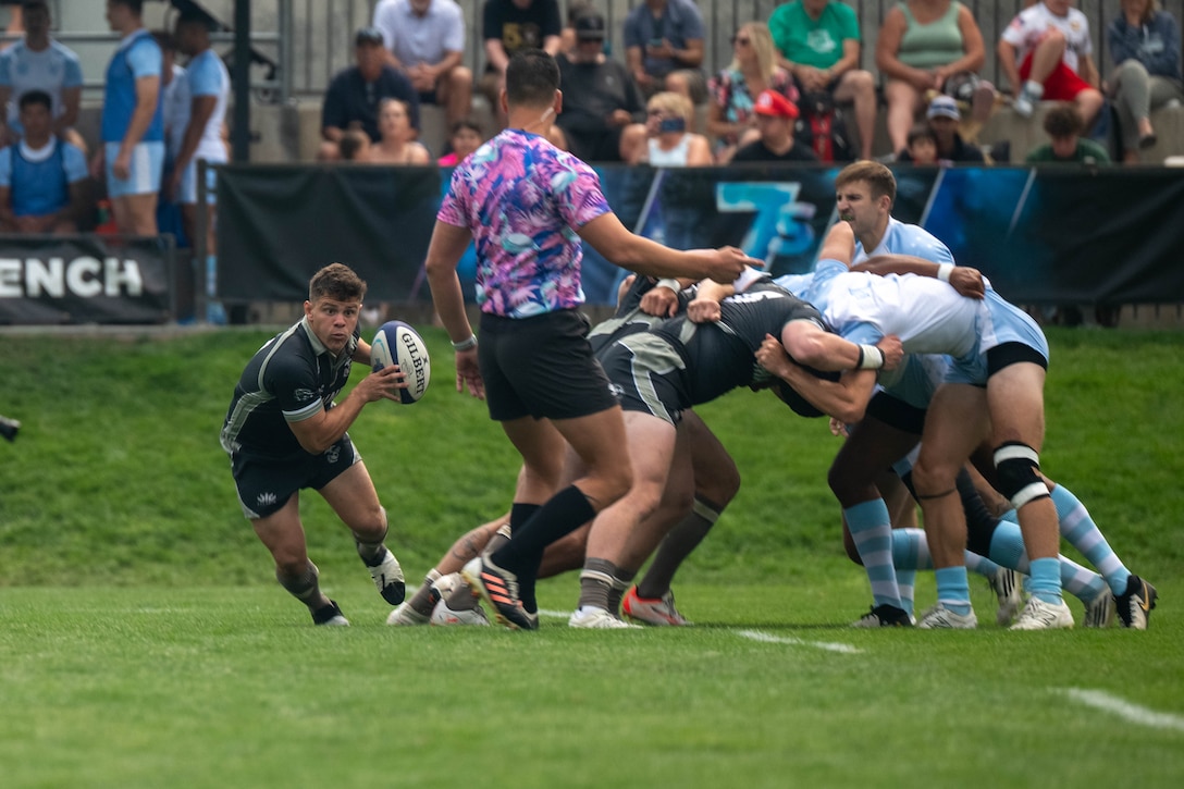 U.S. Marine Corps Lance Cpl. Luis Camacho, back for the U.S. Marine Corps Men’s 7s Rugby team, runs the ball down the field after a scrum. Service members compete in a three-day tournament at Rugbytown USA during the 2025 Armed Forces Men’s 7s Championship at Infinity Park in Glendale, Co. Armed Forces Sports fosters goodwill by promoting physical fitness, providing competitive opportunities for military athletes at national and international levels, enhancing recruitment and retention through sports diplomacy, and building strategic partnerships with allied nations. (U.S. Department of Defense photo by Mass Communication Specialist 2nd Class Theodore C. Lee)