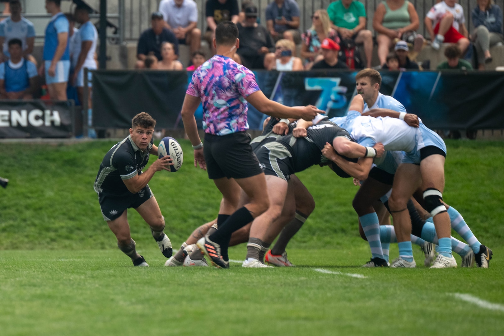 U.S. Marine Corps Lance Cpl. Luis Camacho, back for the U.S. Marine Corps Men’s 7s Rugby team, runs the ball down the field after a scrum. Service members compete in a three-day tournament at Rugbytown USA during the 2025 Armed Forces Men’s 7s Championship at Infinity Park in Glendale, Co. Armed Forces Sports fosters goodwill by promoting physical fitness, providing competitive opportunities for military athletes at national and international levels, enhancing recruitment and retention through sports diplomacy, and building strategic partnerships with allied nations. (U.S. Department of Defense photo by Mass Communication Specialist 2nd Class Theodore C. Lee)