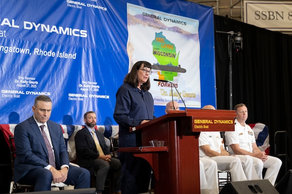 Dr. Kelly Geurts, ship sponsor of the future Columbia-class ballistic missile submarine USS Wisconsin (SSBN 827), delivers remarks during the ship’s keel laying ceremony.