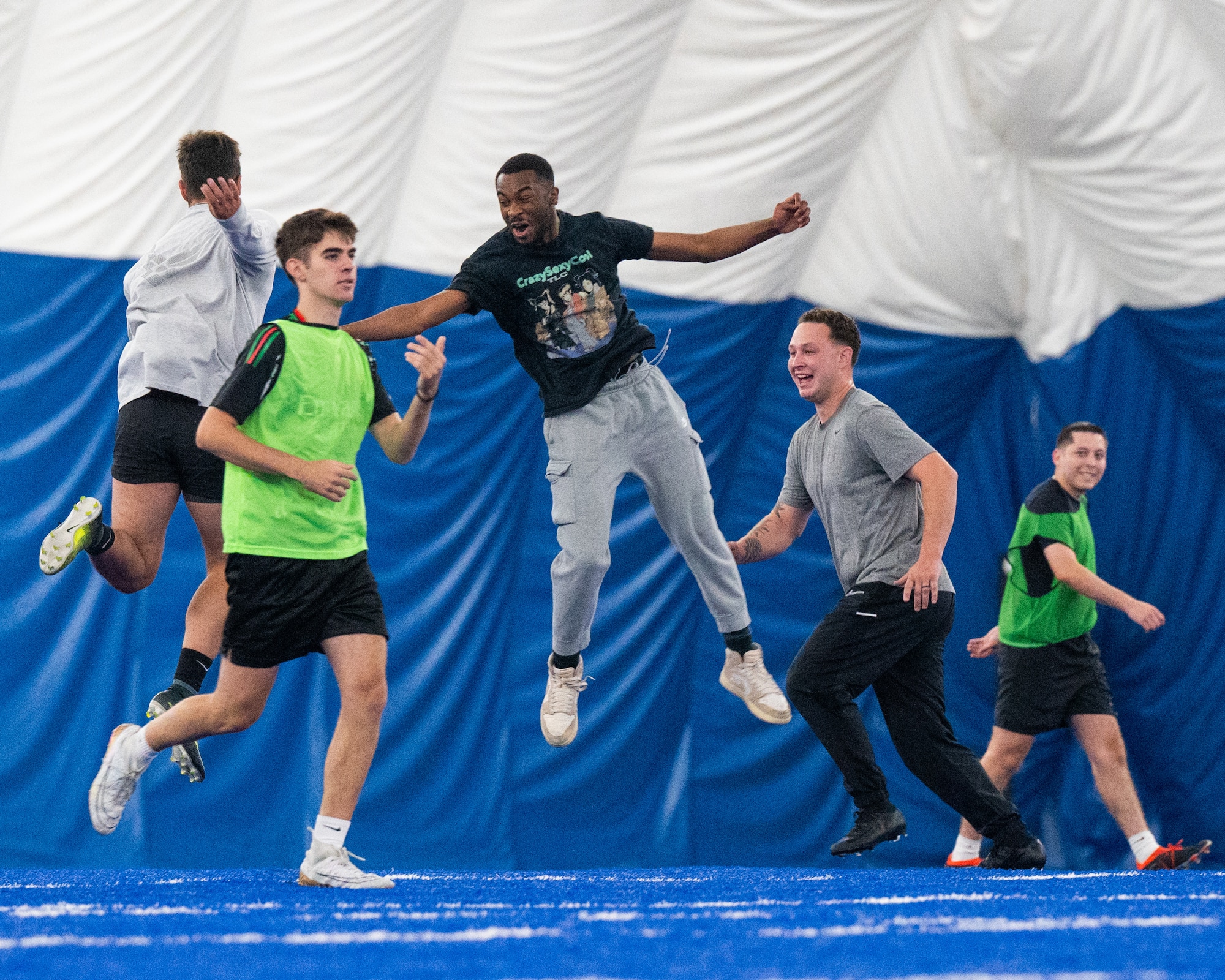 Airmen celebrate winning a soccer match during the Summer Games at Minot Air Force Base, Aug. 22, 2025. The Summer Games is an annual event at Minot AFB featuring a variety of sporting competitions designed to strengthen camaraderie and foster teamwork across Team Minot.