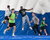 Airmen celebrate winning a soccer match during the Summer Games at Minot Air Force Base, Aug. 22, 2025. The Summer Games is an annual event at Minot AFB featuring a variety of sporting competitions designed to strengthen camaraderie and foster teamwork across Team Minot.