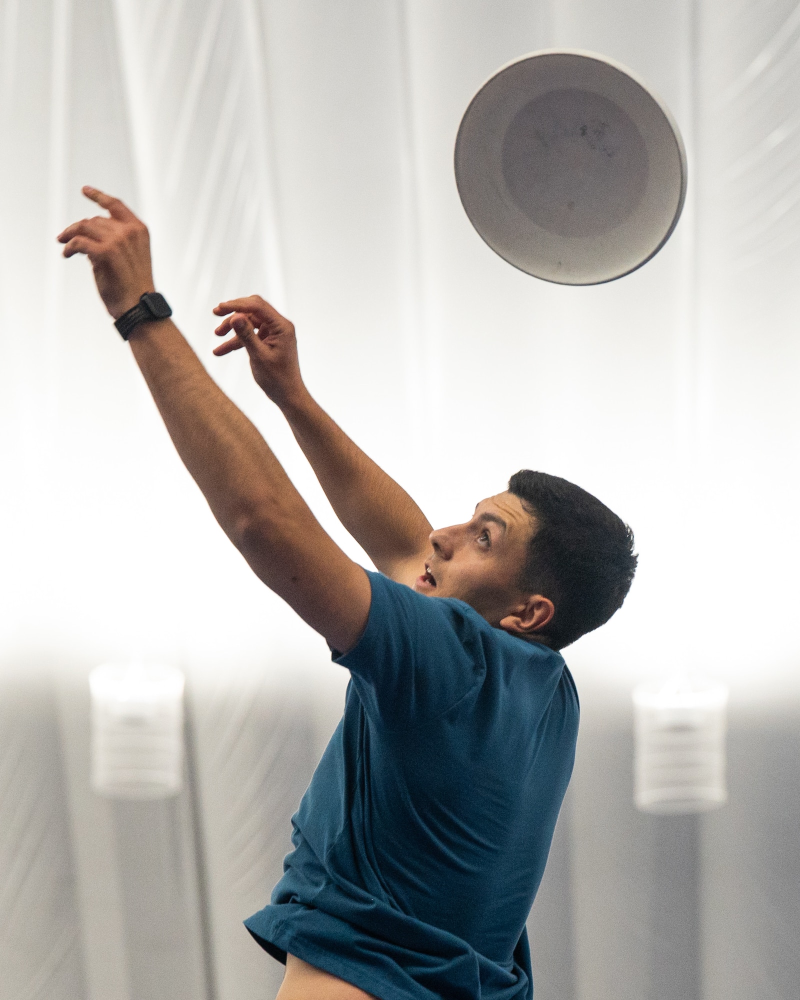 An Airman jumps in an attempt to catch a frisbee during the Summer Games at Minot Air Force Base, Aug. 22, 2025. The Summer Games is an annual event hosted by the 5th Force Support Squadron to encourage physical fitness, camaraderie and competition as well as boost morale.