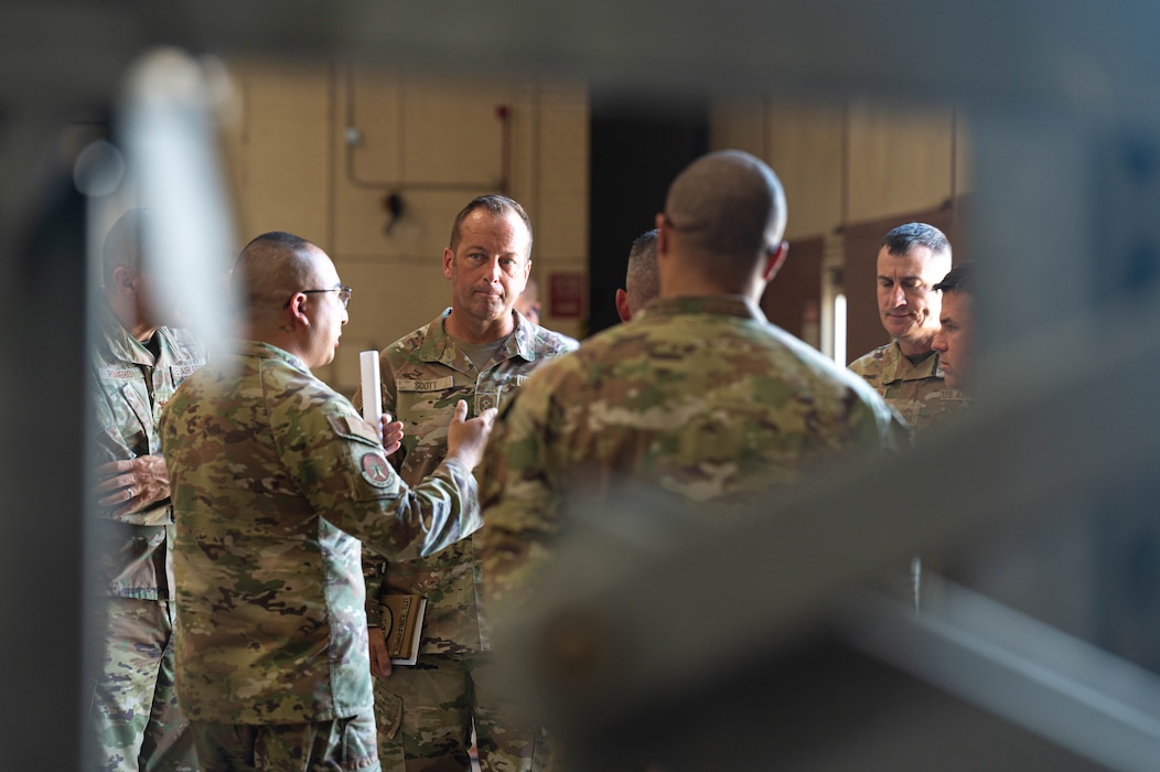 U.S. Air Force Chief Master Sgt. Keith Scott, 19th Air Force command chief, engages in a conversation
