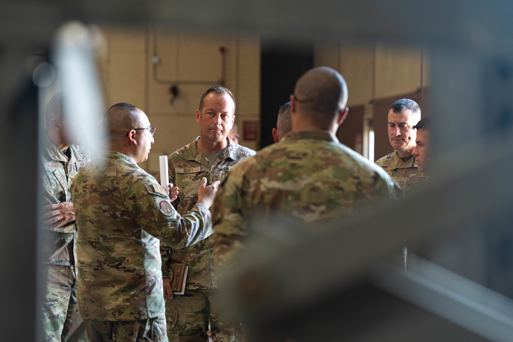U.S. Air Force Chief Master Sgt. Keith Scott, 19th Air Force command chief, engages in a conversation