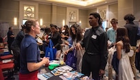 Lauren Hanyok, Capital Tech Bridge Director for Naval Surface Warfare Center, Carderock Division, discusses opportunities at NSWC Carderock with Montgomery County Public Schools’ Summer RISE (Reimagining an Innovative Student Experience) program interns at the program career fair session at the Bethesda North Marriott Hotel and Conference Center in Rockville, Md., July 25, 2024. The session gives students and companies who participated in the program the opportunity to network and learn about different future opportunities, like those offered at Naval Surface Warfare Center, Carderock Division. Carderock is one of the Navy’s pre-eminent research and development facilities that specializes in critical ship design components headquartered in West Bethesda, Maryland. The Carderock Division supports small-scale model testing and evaluation of next-generation surface ships and underwater vessels.