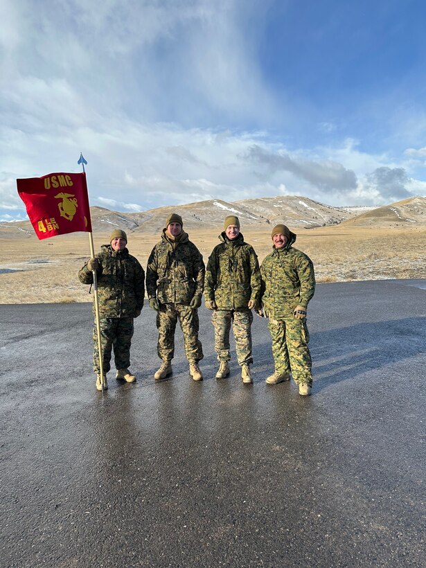 U.S. Marine Corps Capt. Garrett Gundy, incoming commanding officer, Detachment D, Force Headquarters Group, Marine Forces Reserve, poses for a photo with Capt. Avery Moore, outgoing commanding officer, during a change of command ceremony at Ft. Harrison, Helena, Montana, March 20, 2025. The change of command ceremony represents the official passing of authority from the outgoing to incoming commander. (U.S. Marine Corps photo by courtesy of 4th Law Enforcement Battalion)