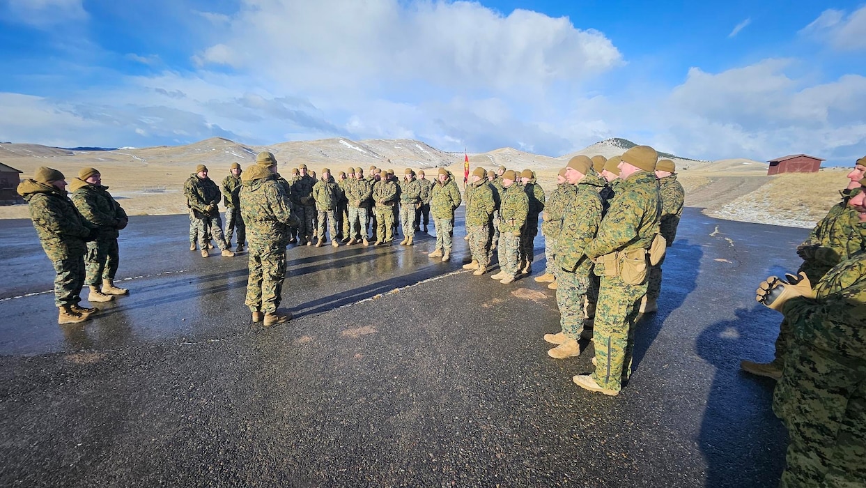 U.S. Marine Corps Capt. Avery Moore, outgoing commanding officer, Detachment D, 4th Law Enforcement Battalion, Force Headquarters Group, Marine Forces Reserve, holds a formation with Capt. Garrett Gundy, incoming commanding officer, after a change of command ceremony at Ft. Harrison, Helena, Montana, March 20, 2025. The change of command ceremony represents the official passing of authority from the outgoing commander to the incoming commander. (U.S. Marine Corps photo by courtesy of 4th Law Enforcement Battalion)