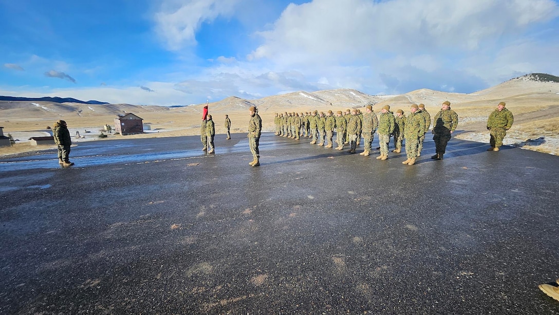U.S. Marine Corps Capt. Avery Moore, outgoing commanding officer, Detachment D, 4th Law Enforcement Battalion, Force Headquarters Group, Marine Forces Reserve, holds a formation with Capt. Garrett Gundy, incoming commanding officer, for a change of command ceremony at Ft. Harrison, Helena, Montana, March 20, 2025. The change of command ceremony represents the official passing of authority from the outgoing commander to the incoming commander. (U.S. Marine Corps photo by courtesy of 4th Law Enforcement Battalion)