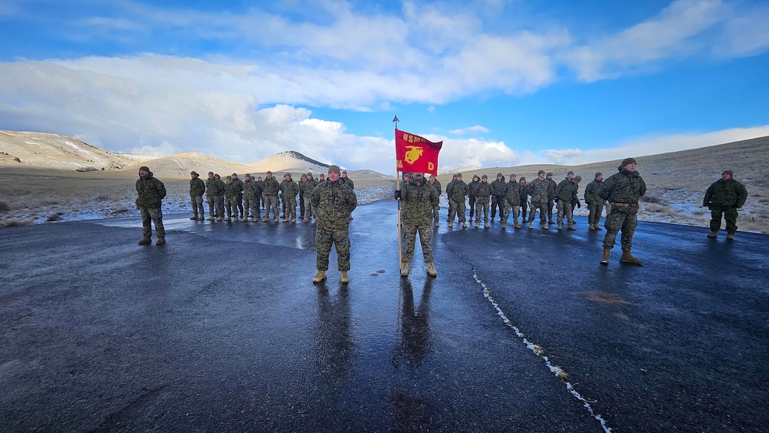 U.S. Marine Corps Capt. Avery Moore, outgoing commanding officer, Detachment D, 4th Law Enforcement Battalion, Force Headquarters Group, Marine Forces Reserve, holds a formation with Capt. Garrett Gundy, incoming commanding officer, for a change of command ceremony at Ft. Harrison, Helena, Montana, March 20, 2025. The change of command ceremony represents the official passing of authority from the outgoing commander to the incoming commander. (U.S. Marine Corps photo by courtesy of 4th Law Enforcement Battalion)
