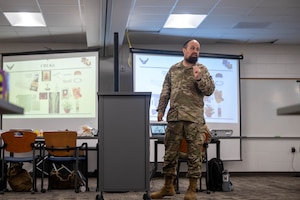 U.S. Air Force Ch, Capt. Levy Pekar 86th Airlift Wing readiness & training chaplain, speaks to the Joint Fatality Management Working Group at Northern Strike 25-2 on Grayling Army Airfield, Michigan, Aug. 12, 2025. Pekar and his team consisted of multiple religious support personnel from different branches and faith groups. (U.S. Air Force photo by Senior Airman Madeline Baisey)