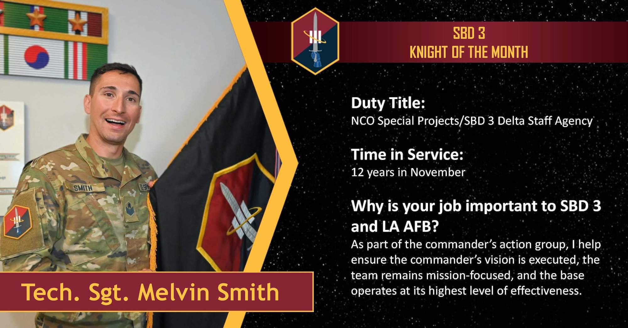 A man in Space Force OCPs stands and points to the Space Base Delta 3 Flag. He is being honored as September 2025 Knight of the Month for his work in the commander's action group.