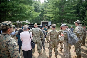 The Joint Fatality Management Working Group observes a vulture as a part of a walking tour of Camp Grayling's participation in the mortuary aspect of exercise Northern Strike 25-2 at Camp Grayling, Michigan, Aug. 11, 2025. The working group is a collaborative effort by multiple agencies to plan for and respond to a mass fatality incident. (U.S. Air Force photo by Senior Airman Madeline Baisey)