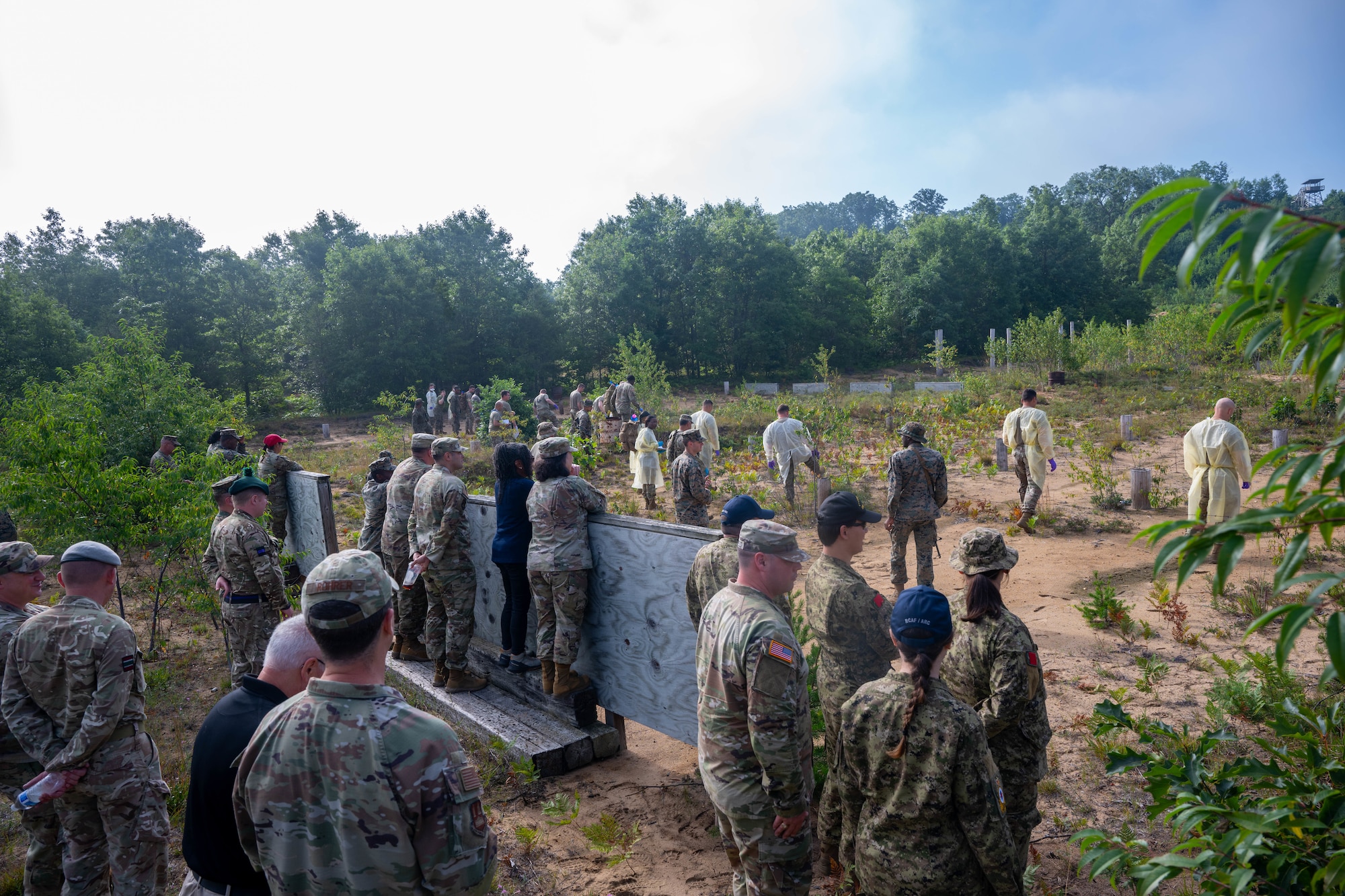 The Joint Fatality Management Working Group observes a vulture as a part of a walking tour of Camp Grayling's participation in the mortuary aspect of exercise Northern Strike 25-2 at Camp Grayling, Michigan, Aug. 13, 2025. The working group is a collaborative effort by multiple agencies to plan for and respond to a mass fatality incident. (U.S. Air Force photo by Senior Airman Madeline Baisey)