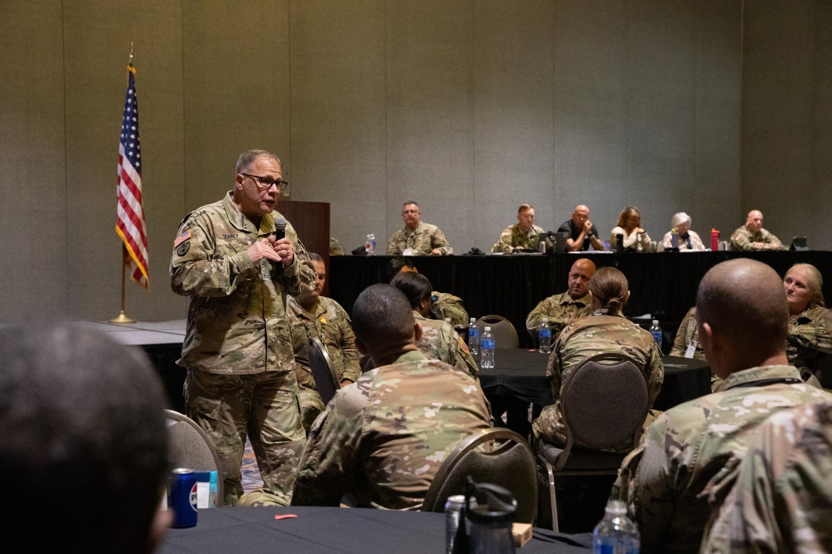 Chief Warrant Officer 5 Brian Searcy, the Command Chief Warrant Officer of the Army National Guard, addresses attendees of a warrant officer caucus session during the National Guard Association of the United States (NGAUS) conference in Milwaukee, August 24, 2025.