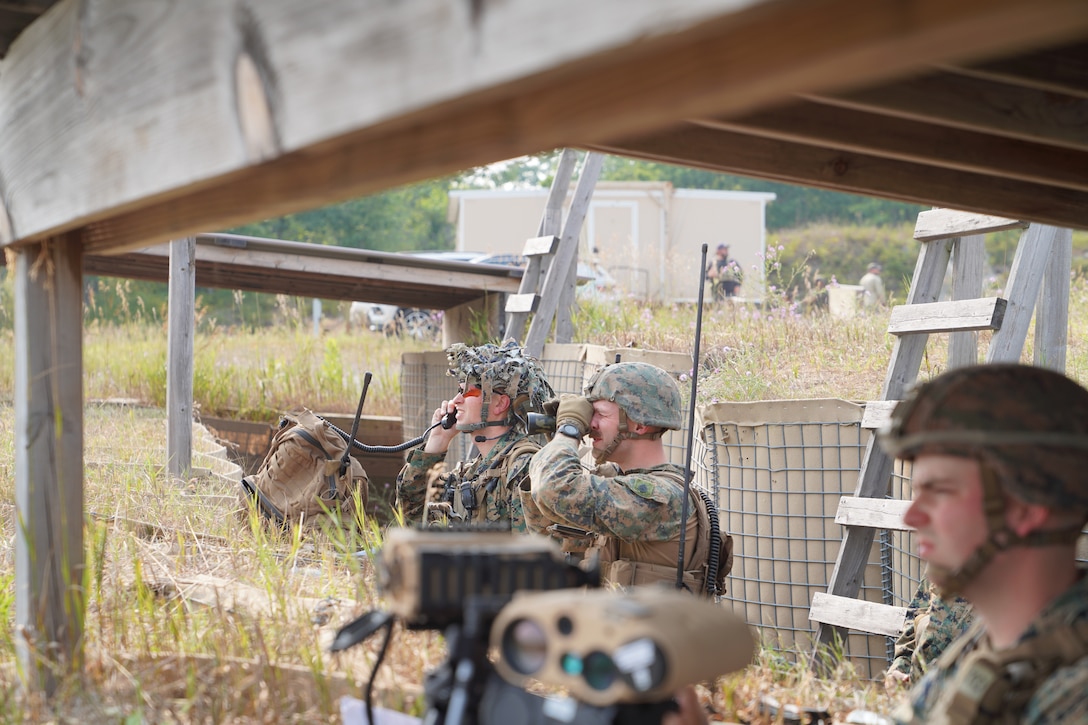 U.S. Marines with 6th Air Naval Gunfire Liaison Company, Force Headquarters Group, Marine Forces Reserve, observe close air support during Northern Strike 25-2 at Camp Grayling, Michigan, Aug. 4, 2025. Marines at NS 25-2 continue to enhance joint force lethality by coordinating and controlling CAS missions in complex, multinational environments. (U.S. Marine Corps photo by Master Sgt. Latasha Esperon)