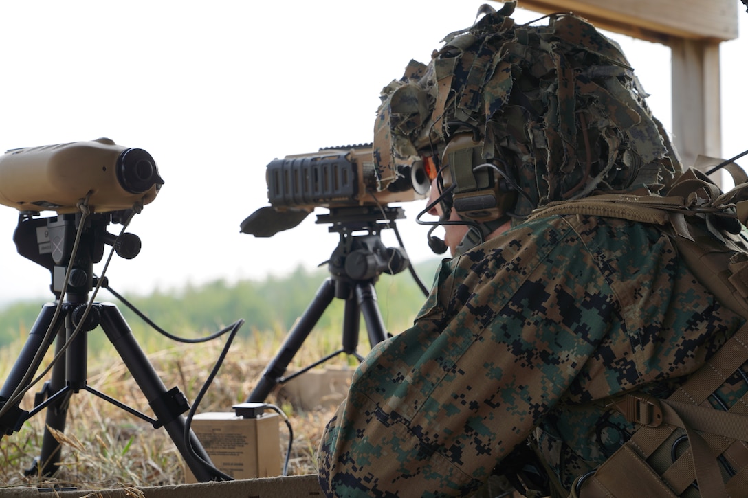 U.S. Marine Corps Sgt. Jonah Jacobson, a fire support Marine with 6th Air Naval Gunfire Liaison Company, Force Headquarters Group, Marine Corps Forces Reserve, utilizes an Enhanced Joint Terminal Attack Controller - Laser Target Designator to acquire target information during exercise Northern Strike 25-2 at Camp Grayling, Michigan, Aug. 4, 2025. Marines at NS 25-2 continue to enhance joint force lethality by coordinating and controlling CAS missions in complex, multinational environments. (U.S. Marine Corps photo by Master Sgt. Latasha Esperon)