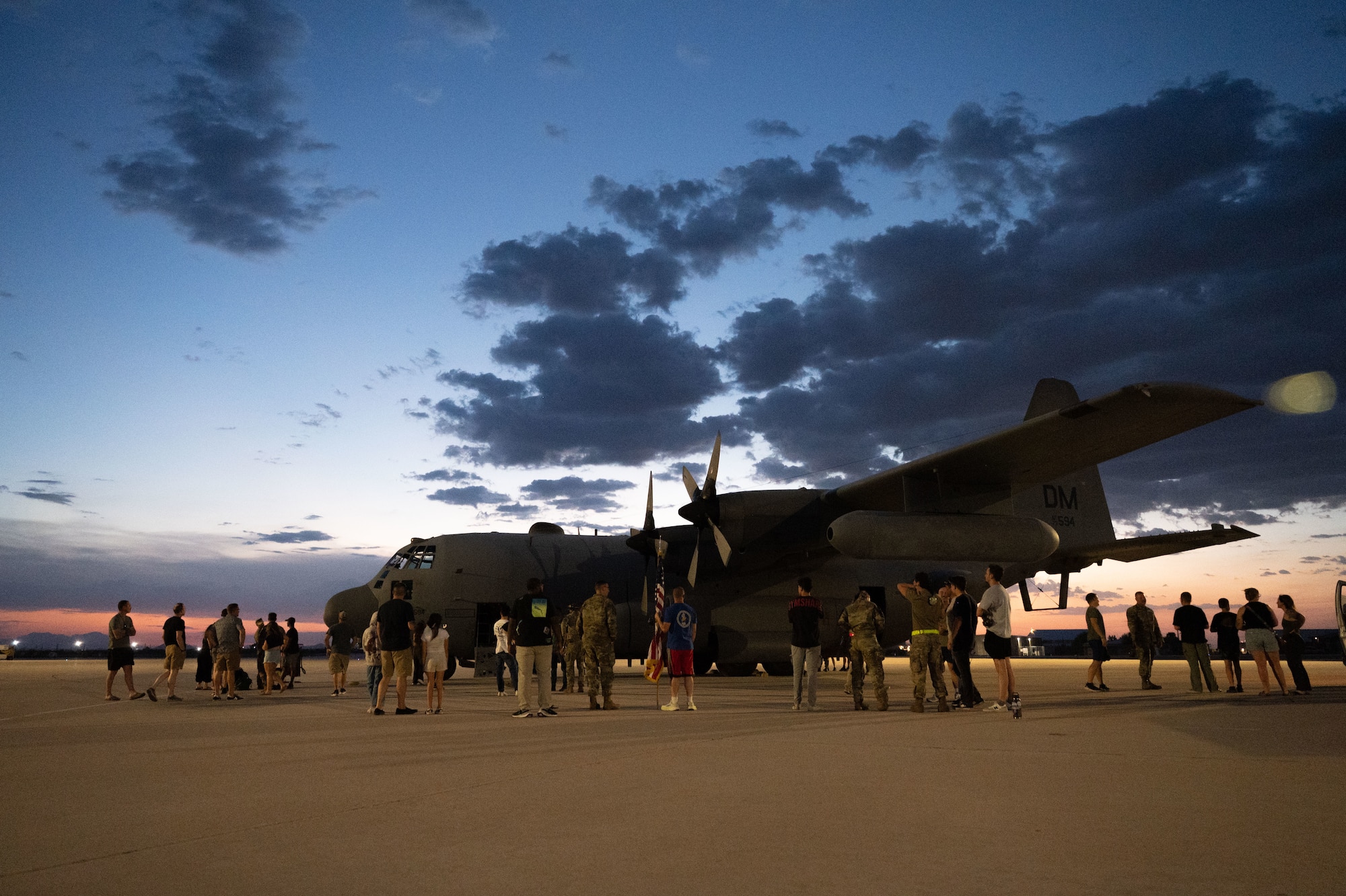 U.S. Airmen assigned to the 42nd Electronic Combat Squadron are greeted by their families after returning from a contingency deployment at Davis-Monthan Air Force Base, Arizona, August 23, 2025. The 42nd ECS provides the 55th Electronic Combat Group with simulator support for both initial qualification and continuation training. (U.S. Air Force photo by Airman Jaden Kidd)