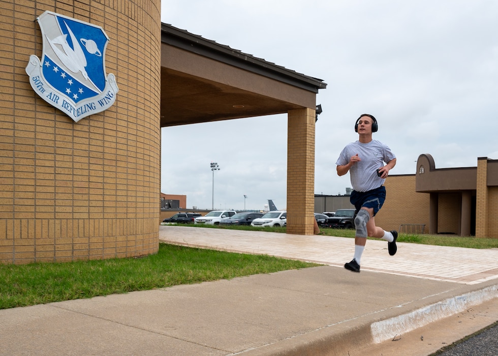 man runs on sidewalk