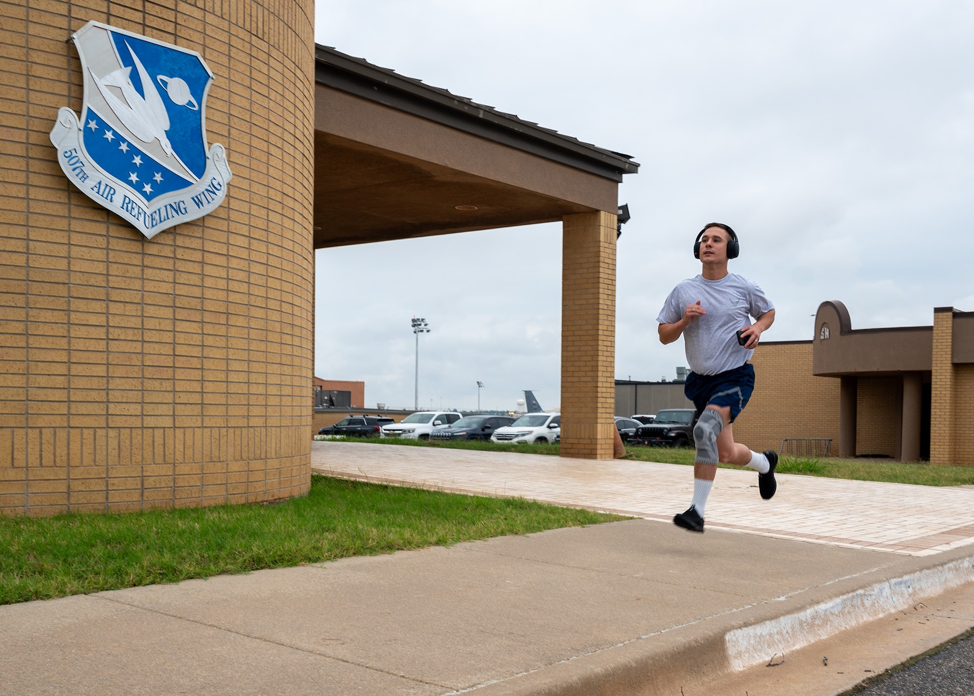 man runs on sidewalk
