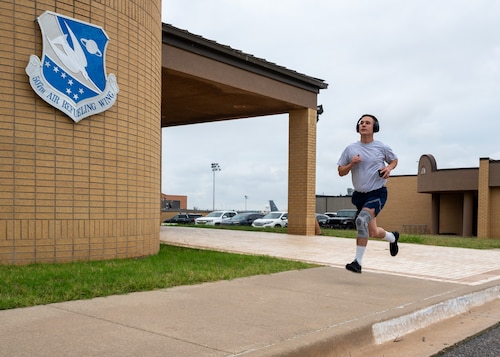 man runs on sidewalk