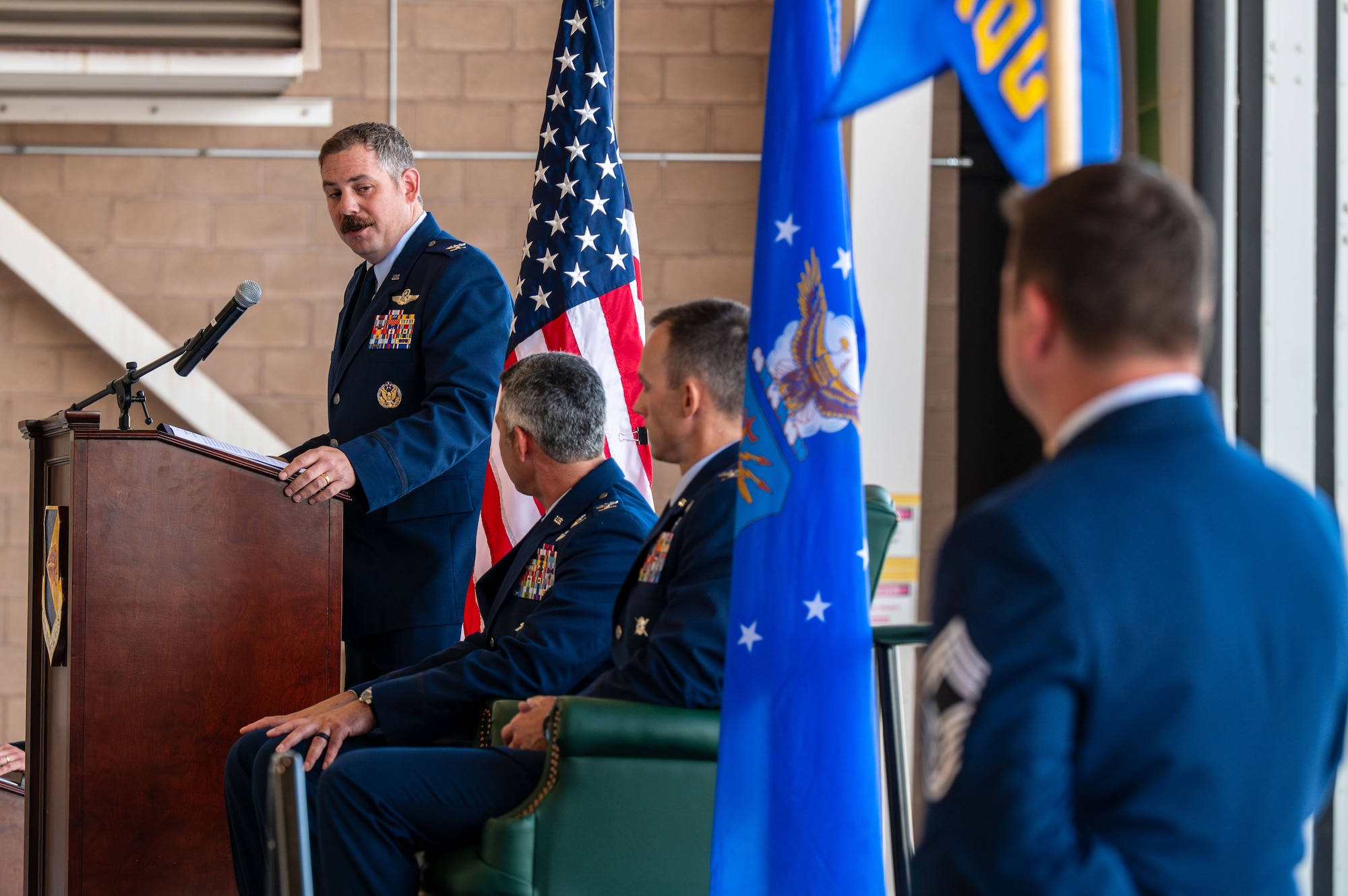 U.S. Air Force Col. Charles Redmond, 563rd Rescue Group outgoing commander, speaks during the 563rd RQG Change of Command ceremony at Davis-Monthan Air Force Base, Arizona, Aug. 28, 2025. Redmond was responsible for the overall combat training and readiness of more than 650 personnel at the 563rd RQG. (U.S. Air Force photo by Senior Airman Jasmyne Bridgers-Matos)