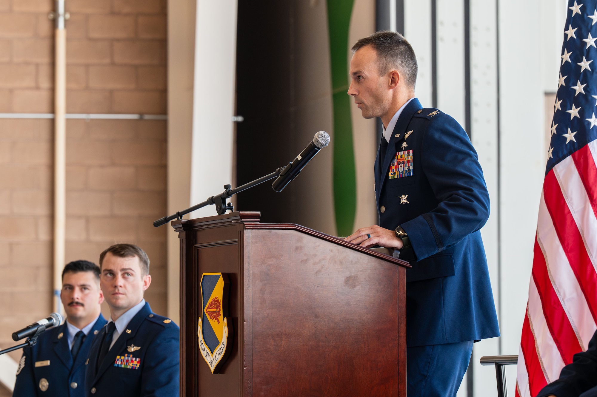 U.S. Air Force Col. Nicholas Morgans, 563rd Rescue Group incoming commander, speaks during the 563rd RQG Change of Command ceremony at Davis-Monthan Air Force Base, Arizona, Aug. 28, 2025. Morgans expressed his enthusiasm to lead and serve alongside the Airmen of the 563rd RQG. (U.S. Air Force photo by Senior Airman Jasmyne Bridgers-Matos)