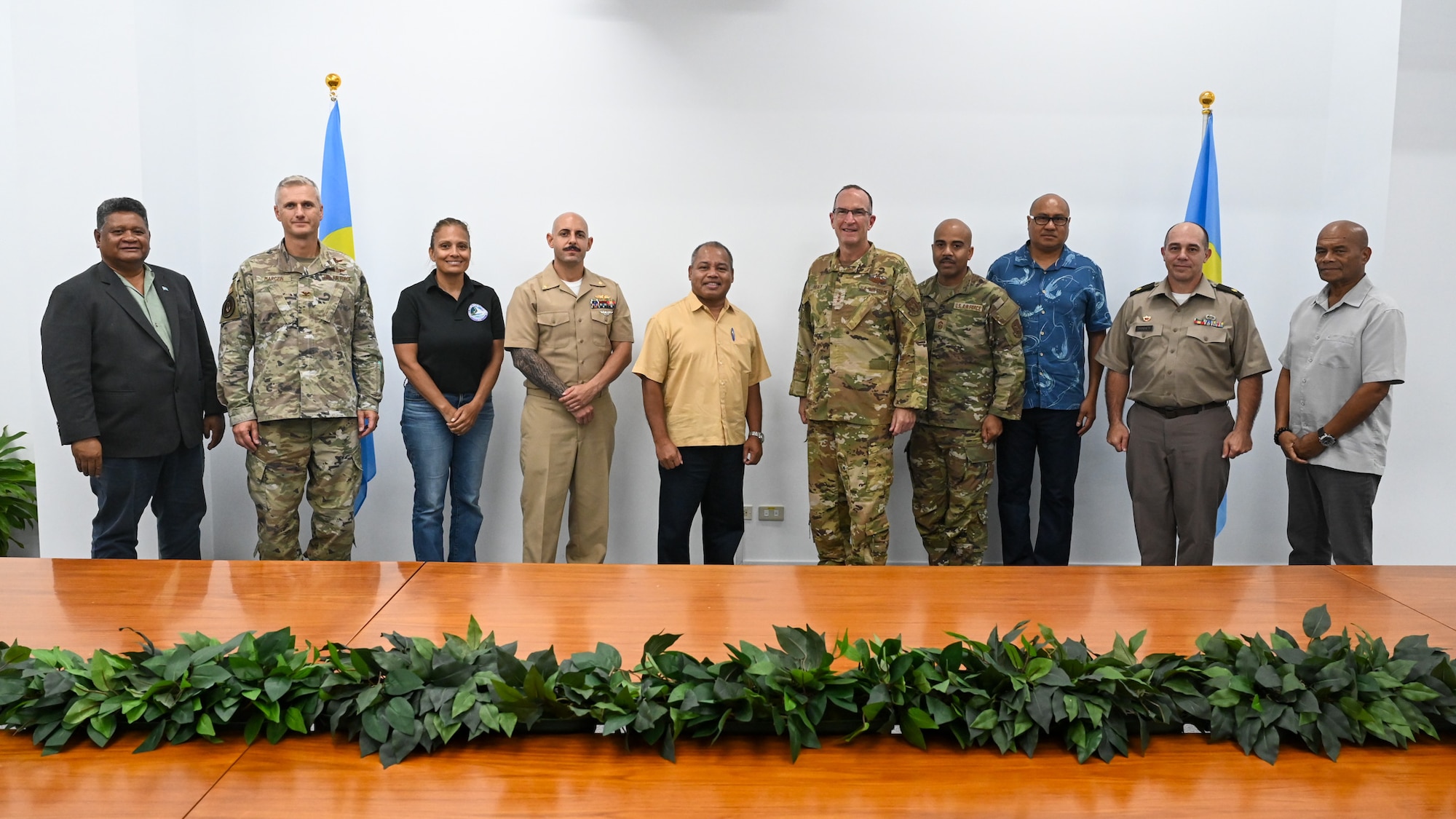 Group of officials standing in a line to pose for a photo
