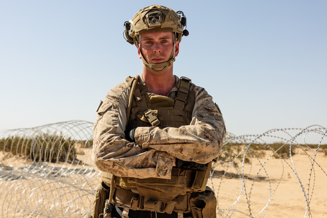 U.S. Marine Corps Gunnery Sgt. Matthew Nygaard, a Hastings, Minnesota native, the 2025 Marine Corps Engineer Association Combat Engineer Staff Noncommissioned Officer of the Year, and an operations chief with Combat Logistics Battalion 15 (CLB-15), Combat Logistics Regiment 17, 1st Marine Logistics Group, assigned to Joint Task Force-Southern Border (JTF-SB), poses for a portrait before preparing concertina wire to be placed on the southern border barrier in Yuma, Ariz., Aug. 11, 2025. JTF-SB executes full-scale, agile, and all-domain operations in support of U.S. Customs and Border Protection to protect the territorial integrity of the United States and achieve 100% operational control of the southern border. (U.S. Marine Corps photo by Sgt. Mary Torres)