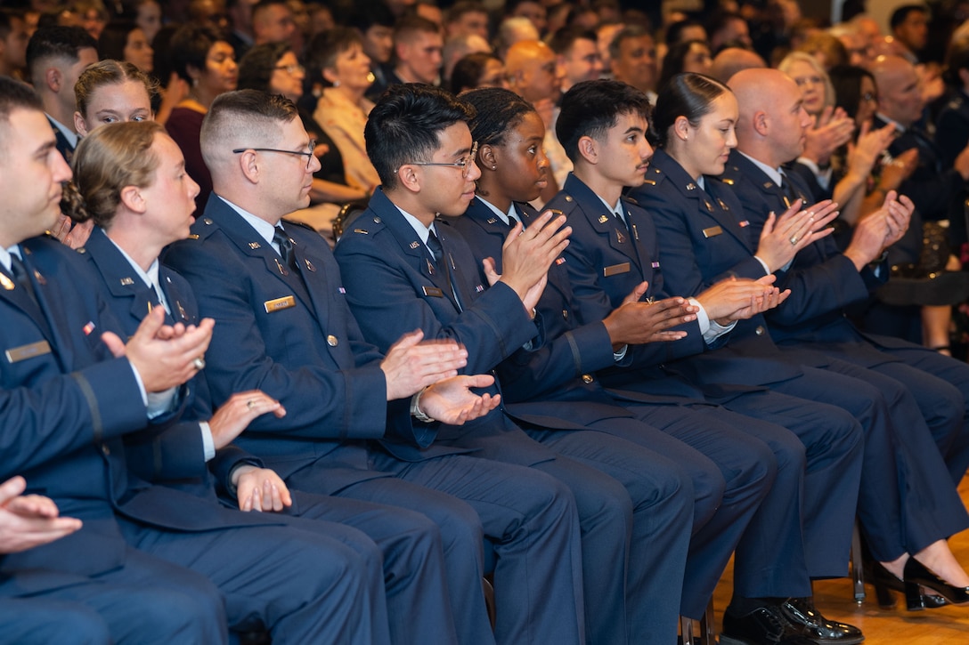 OTC graduation with Guardians in uniform. Photos feature pinning ceremony and officers in their formal blues.