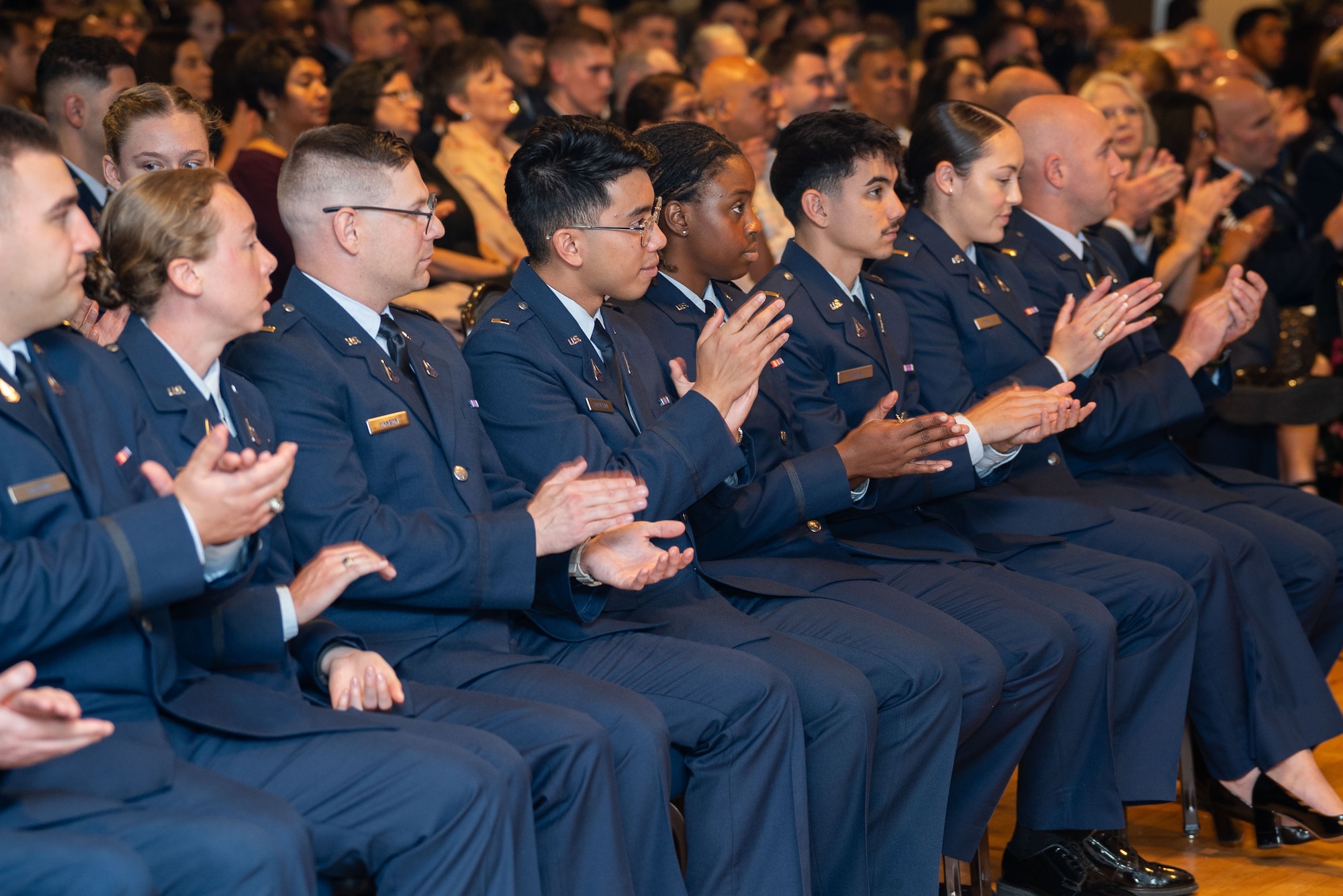 OTC graduation with Guardians in uniform. Photos feature pinning ceremony and officers in their formal blues.