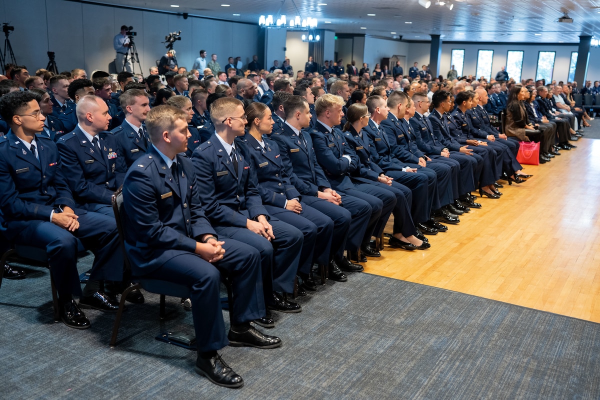 OTC graduation with Guardians in uniform. Photos feature pinning ceremony and officers in their formal blues.