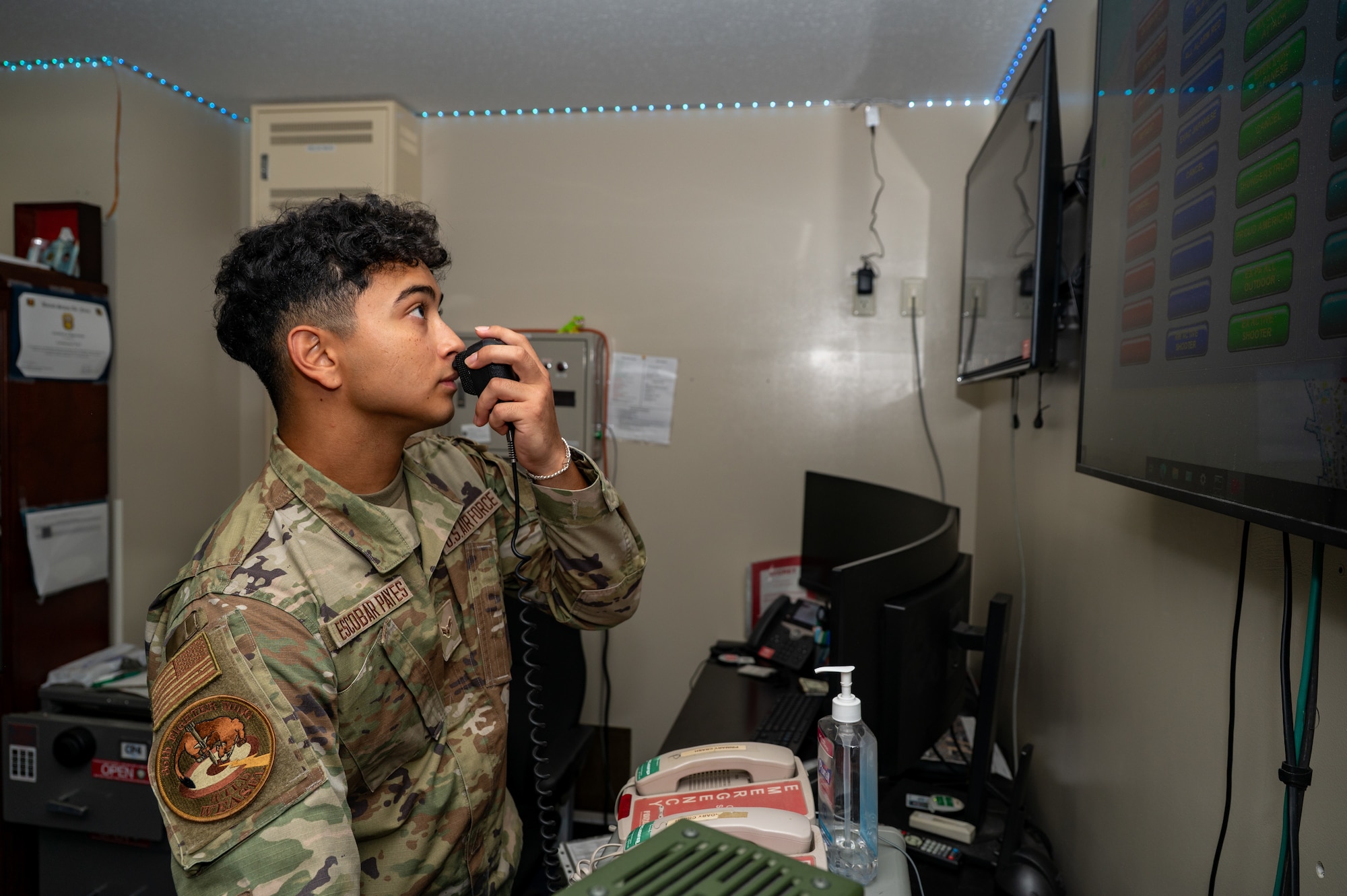 U.S. Air Force Airman 1st Class Josue Escobar-Payes, 35th Fighter Wing Staff Agency command post controller, speaks into the giant voice broadcasting system’s microphone during a Wild Weasel Walk-through at Misawa Air Base.