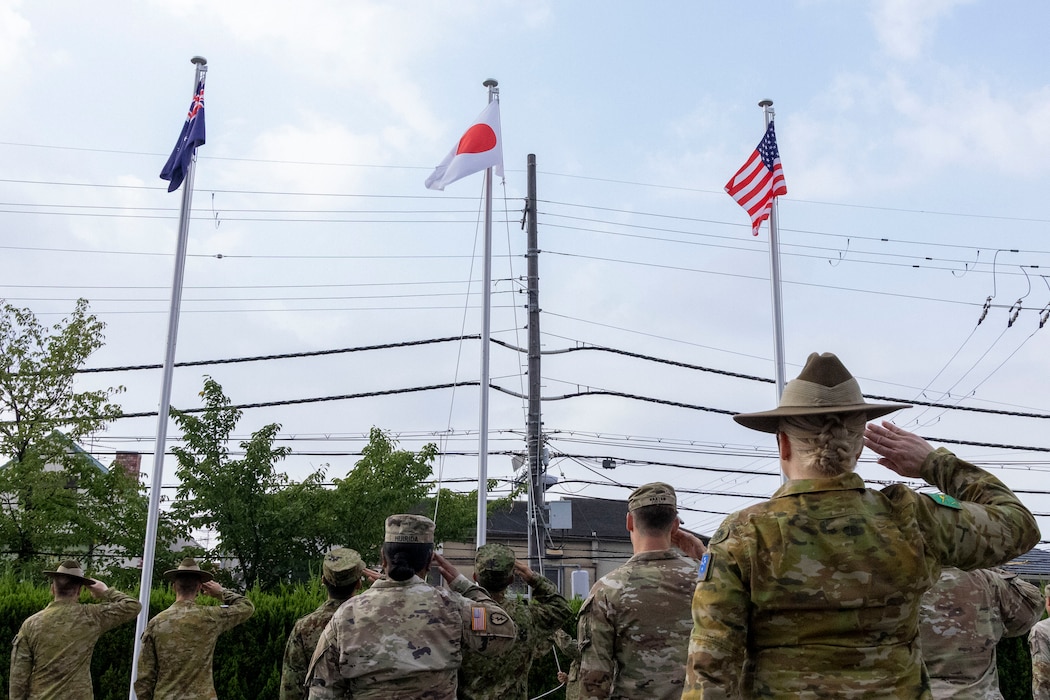 Australian Army, Japan Ground Self-Defense Force, and U.S. Army service members salute the Allied Nation’s Flags during a ceremonial flag raising at Camp Itami, Japan, Aug. 26, 2025.
