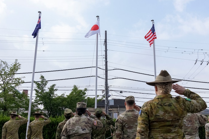 Australian Army, Japan Ground Self-Defense Force, and U.S. Army service members salute the Allied Nation’s Flags during a ceremonial flag raising at Camp Itami, Japan, Aug. 26, 2025.
