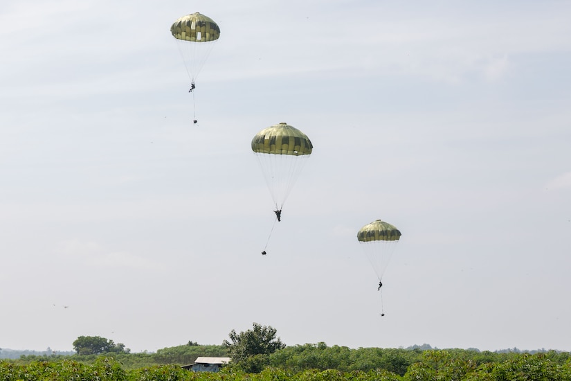 Indonesian National Armed Forces and Japan Ground Self-Defense Force paratroopers conduct an airborne jump with the MC1-1B Parachute onto a drop zone in Baturaja, Indonesia, during Super Garuda Shield 25, Aug. 27, 2025.