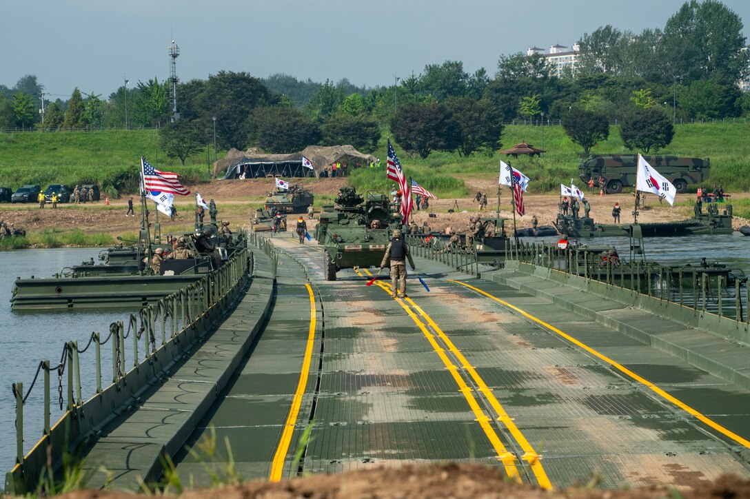 U.S. Army Soldiers assigned to the 11th Engineer Battalion, 2d Infantry Division Sustainment Brigade, 2d Infantry Division/ROK-U.S. Combined Division, drive over the completed bridge with an M1126 Stryker during a combined wet-gap crossing training exercise as part of Ulchi Freedom Shield near Yeoju, South Korea, Aug. 27, 2025.