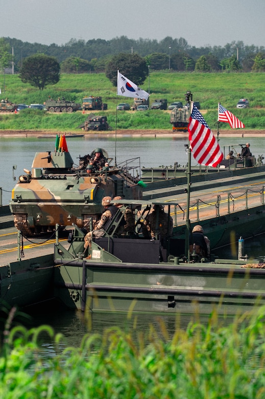 A Republic of Korea Army soldier assigned to the ROK 7th Engineer Brigade, drives over a completed bridge in a K200 armed vehicle during a combined wet-gap crossing training exercise as part of Ulchi Freedom Shield near Yeoju, South Korea, Aug. 27, 2025.