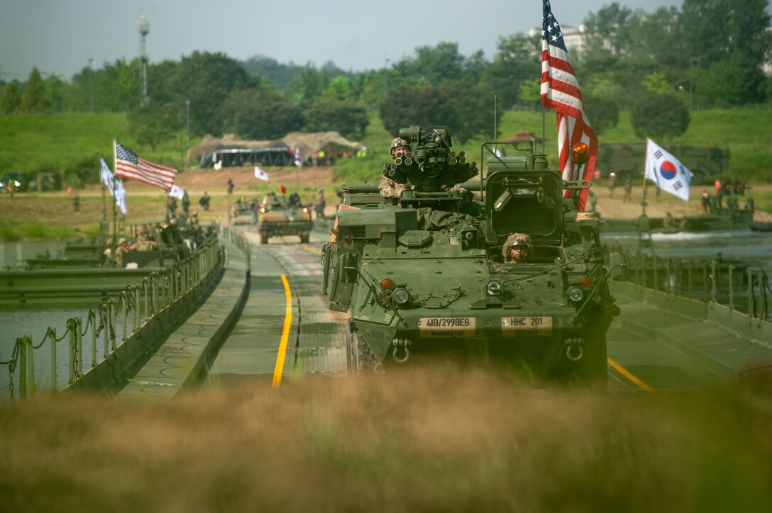 U.S. Army Soldiers assigned to the 11th Engineer Battalion, 2d Infantry Division Sustainment Brigade, 2d Infantry Division/ROK-U.S. Combined Division, drive over the completed bridge with an M1126 Stryker during a combined wet-gap crossing training exercise as part of Ulchi Freedom Shield near Yeoju, South Korea, Aug. 27, 2025.