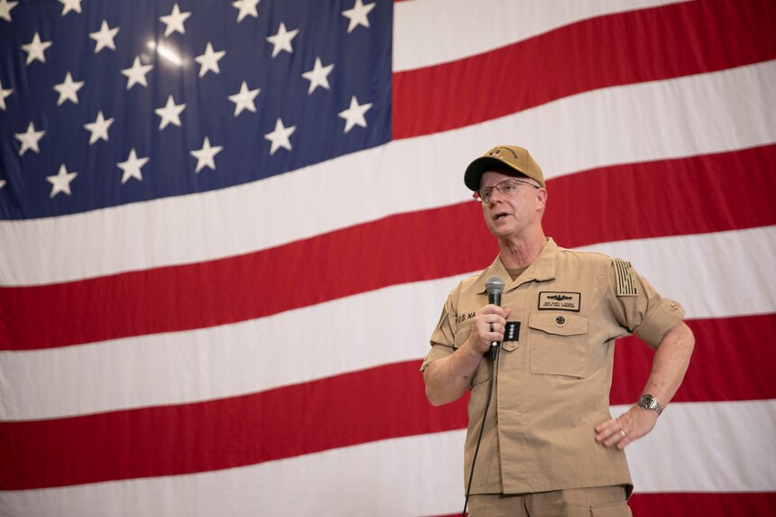 Chief of Naval Operations (CNO) Adm. Daryl Caudle addresses Sailors during an all-hands call in the hangar bay aboard the Nimitz-class aircraft carrier USS Harry S. Truman (CVN75) in Norfolk, Va., Aug. 28.