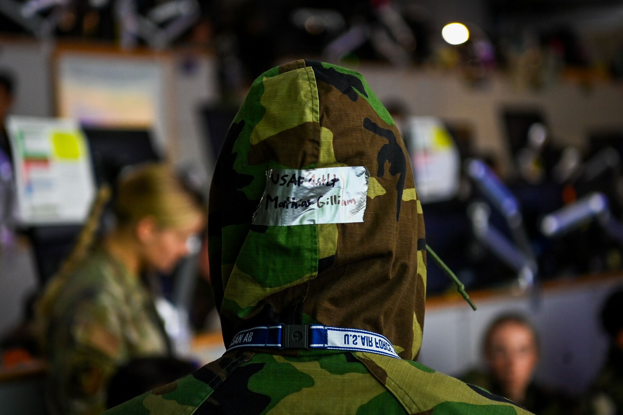 man stands away from camera in MOPP gear