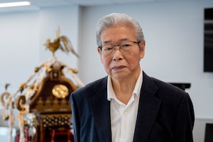 Aoki Shijegi, mikoshi shrine craftsman, poses for a photo.