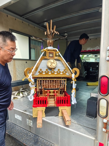 Mikoshi shrines are prepared to be transported.