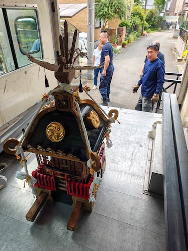 Mikoshi shrines are prepared to be transported