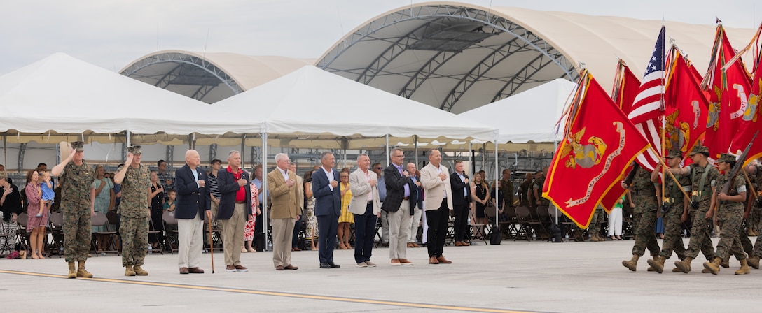 Current and former commanding generals of 2nd Marine Aircraft Wing (MAW) render their respects to colors during a change of command ceremony at Marine Corps Air Station Cherry Point, North Carolina, Aug. 28, 2025. The ceremony represented a transfer of responsibility, authority, and accountability from Maj. Gen. William H. Swan to Maj. Gen. Ryan S. Rideout. 2nd MAW generates, deploys and sustains expeditionary, combat-ready aviation forces for II Marine Expeditionary Force, the Marine Corps and the joint force. (U.S. Marine Corps photo by Sgt. Rowdy Vanskike)
