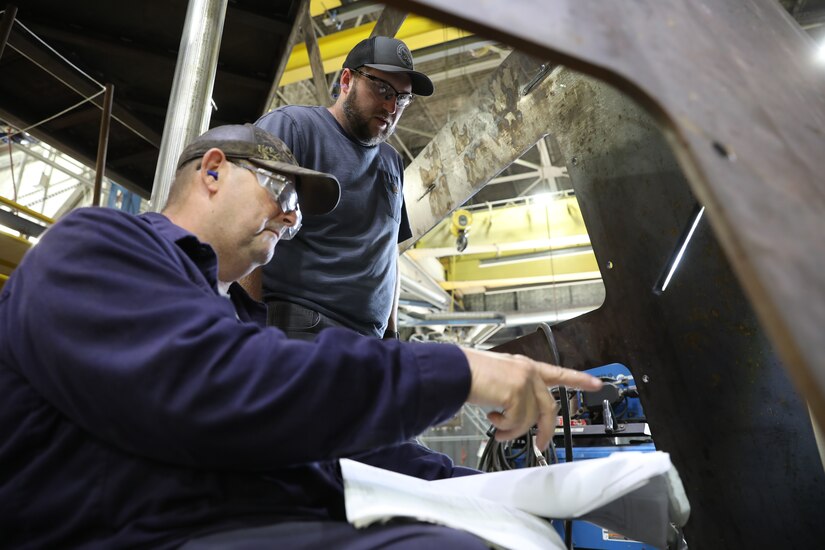Letterkenny Army Depot artisans work on fabricating and assembling a test stand set, known as a sponson, at the depot on May 7, 2024.