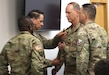Sgt. Maj. Troy Gearhart, incoming Letterkenny Army Depot sergeant major, accepts the LEAD sword from Col. Donald Santillo, LEAD commander, during a change of responsibility ceremony, March 28, conducted in the depot’s headquarters building.