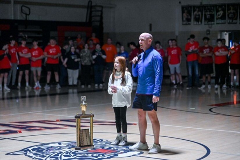 Jeremy Crouse (right), LEAD Directorate of Supply and Transportation deputy director, stands with his daughter, Willow, as they discuss the Creating Hope And Making Progress program on Feb. 28, 2025, at Huntingdon High School.