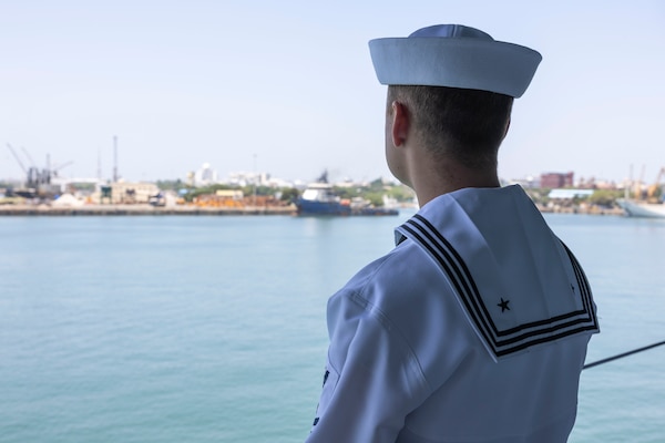 CHENNAI, India (Aug. 24, 2025) – Electrician's Mate (Nuclear) 2nd Class Noah Welk, assigned to the forward-deployed submarine tender USS Frank Cable (AS 40), mans the rails during the ship’s arrival to Chennai, India for a port visit, Aug. 24, 2025. Frank Cable is underway supporting the U.S. 7th Fleet, the U.S. Navy’s largest forward deployed numbered fleet, operating with allies and partners in preserving a free and open Indo-Pacific region. (U.S. Navy photo by Mass Communication Specialist 3rd Class Haley Wilson)