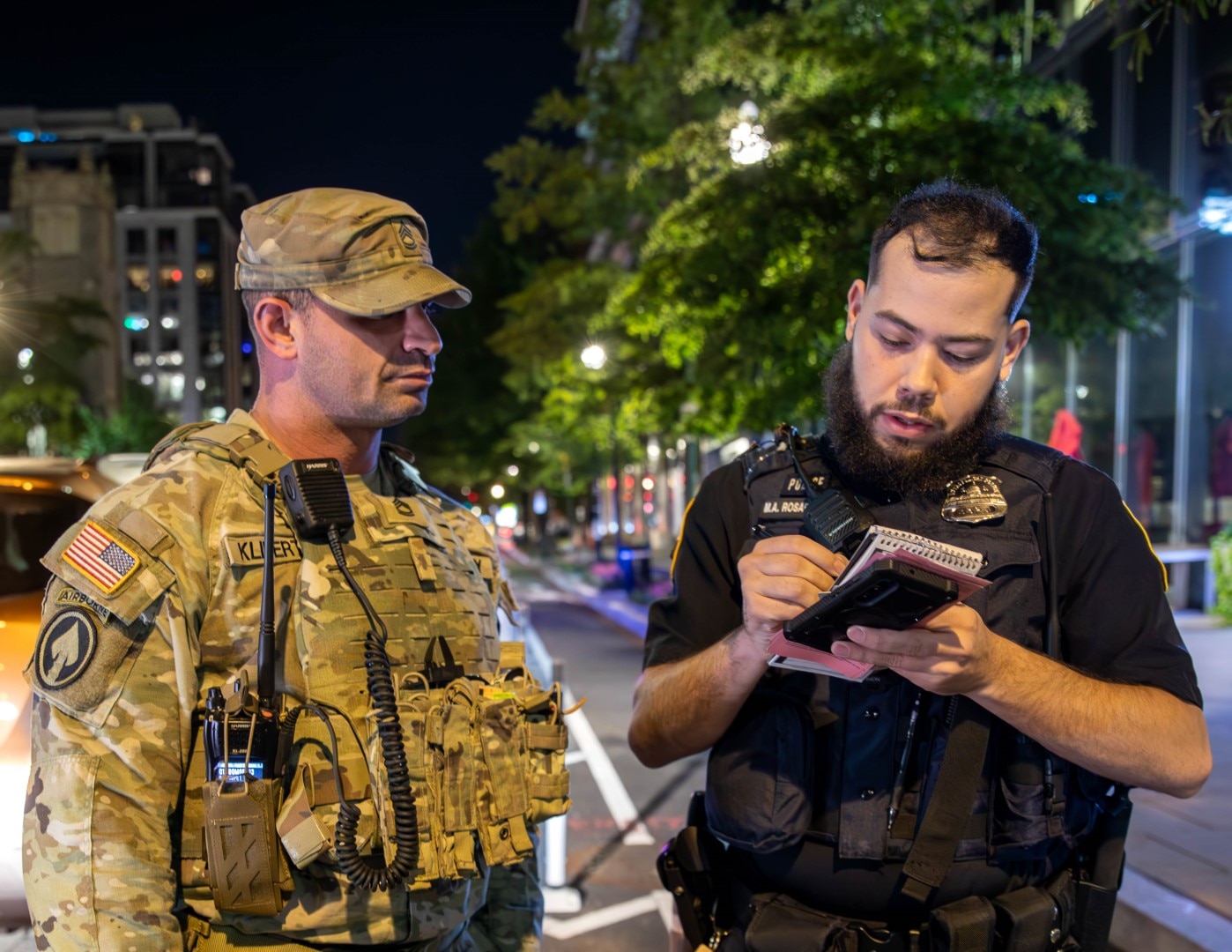 U.S. Army Sgt. 1st Class Britten Klibert, left, assigned to the Tennessee Army National Guard, provides military police support to civil authorities in Washington, D.C., Aug. 23, 2025.